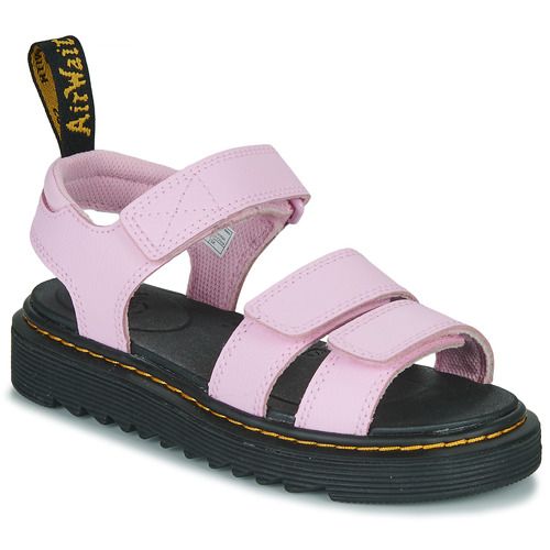 Sandali Dr. Martens per bambina ragazza Klaire J in colore rosa, stile trendy e resistente, perfetti per l'estate. Scarpe comode e alla moda, ideali per ogni occasione, dalla scuola ai momenti di svago. Design iconico e qualità Dr. Martens, per un look unico e alla moda.