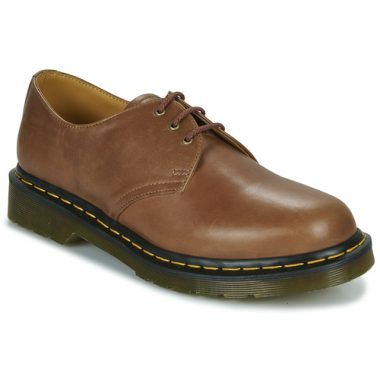 Scarpe uomo Dr. Martens 1461 SADDLE TAN CARRARA Marrone Derby, caratterizzate da un design classico e una solida costruzione in pelle. Perfette per un look casual elegante, queste scarpe offrono comfort e durata, ideali per ogni occasione. Scopri il fascino intramontabile delle Dr. Martens per un outfit alla moda e di tendenza.
