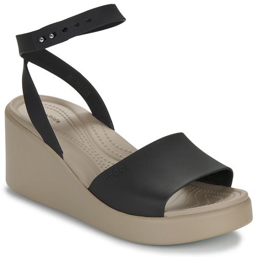 Sandali Donna Crocs BROOKLYN WEDGE in colore Nero, caratterizzati da un design elegante e confortevole, ideali per ogni occasione estiva. Gli innovativi wedge offrono un'ottima altezza senza rinunciare al comfort. Perfetti per passeggiate in città o per un aperitivo con le amiche. Scopri il tuo stile con i sandali BROOKLYN WEDGE di Crocs.