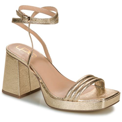 Sandali donna Les Petites Bombes IVANA in oro, eleganti e alla moda, perfetti per eventi estivi e serate. Design raffinato con dettagli curati, ideali per completare ogni outfit. Scopri il comfort e lo stile di questi sandali, un must-have per la tua collezione di calzature.