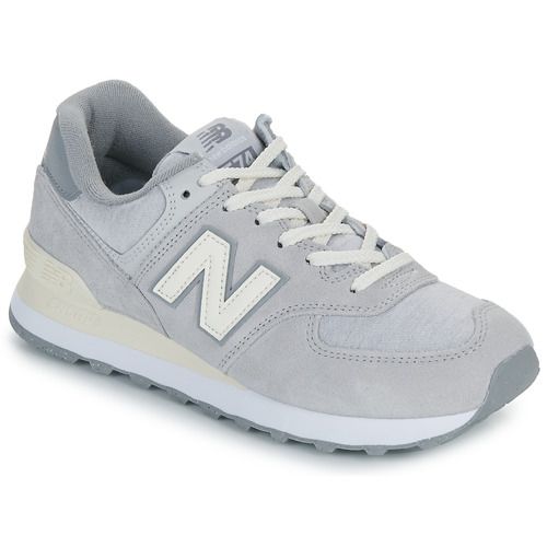 Sneakers basse New Balance 574 Grigio Donna, eleganti e sportive, perfette per ogni occasione. Design versatile con dettagli contemporanei, comfort eccellente e suola resistente. Acquista ora per un look trendy e alla moda!