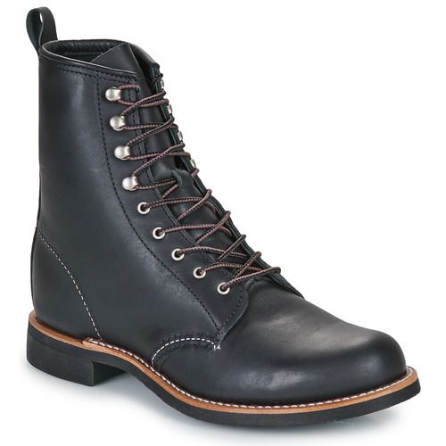 Stivaletti Donna Nero Red Wing SILVERSMITH, eleganti e robusti, realizzati in pelle di alta qualità. Design classico e versatile, perfetti per ogni outfit, ideali per la stagione autunnale e invernale. Comfort e stile assicurati per un look alla moda.