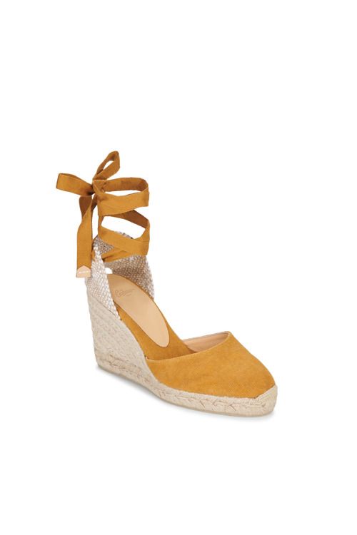 Espadrillas donna Castaner CARINA in giallo, con suola in corda e dettagli eleganti. Ideali per l'estate, perfette per look casual e raffinati. Scopri il comfort e lo stile di queste iconiche espadrillas per completare il tuo outfit.