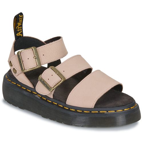 Sandali Dr. Martens Gryphon Quad in morbido nubuck milled color rosa powder, ideali per le donne che cercano stile e comfort. Questi sandali alla moda presentano una suola alta per un look audace e un design versatile, perfetti per abbinamenti estivi. Scopri la tua nuova calzatura preferita che unisce durata e tendenze attuali.