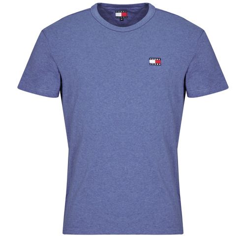 T-shirt Tommy Jeans TJM REG BADGE TEE EXT Blu, maniche corte per uomo, stile casual. Ideale per un look trendy e urbano, perfetta da abbinare a jeans o pantaloni. Acquista ora la tua T-shirt Tommy Jeans, un must-have per il tuo guardaroba!