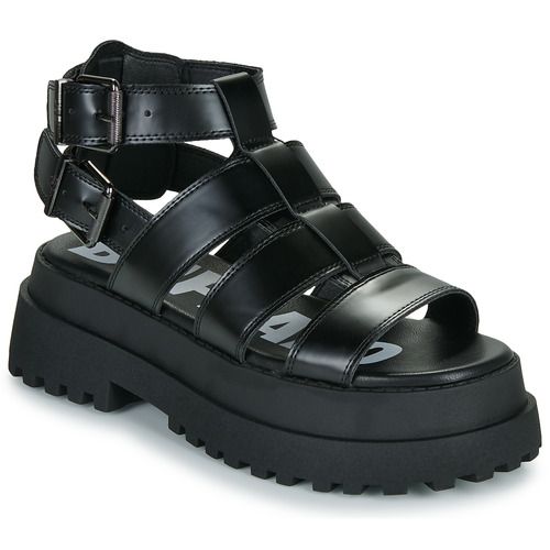 "Sandali donna Buffalo PLUTO GLD in nero, design elegante e alla moda, ideali per ogni occasione. Perfetti per un look chic e confortevole, questi sandali offrono stile e versatilità."