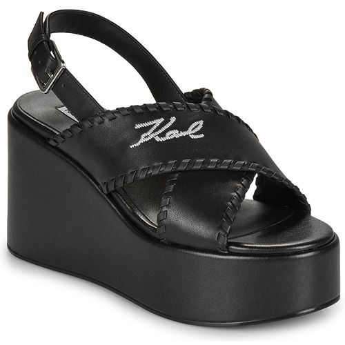 Sandali Donna Karl Lagerfeld WENDY Whipstich Kross Strap Nero, eleganti e trendy, perfetti per ogni occasione. Design chic con dettagli whipstich e cinturini incrociati, ideali per l'uso quotidiano o per eventi speciali. Aggiungi un tocco di stile al tuo guardaroba con questi sandali alla moda.