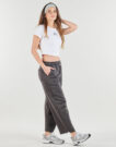 Pantaloni Sportivi  New Balance  LINEAR HERITAGE FLEECE BARREL PANT  Nero -   Pantaloni Sportivi Donna - 3